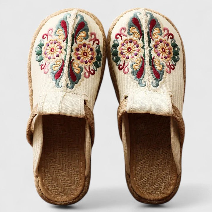 Women white floral embroidered flat mule shoes with woven jute sole front view