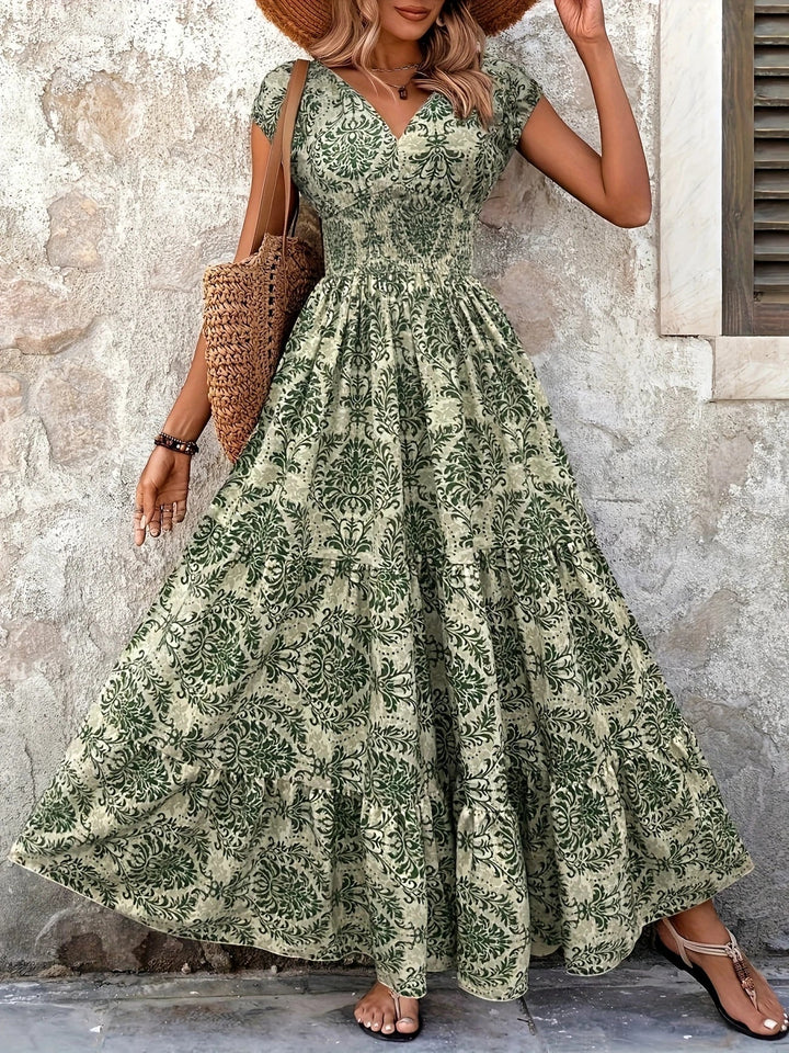 Women green paisley print maxi dress with V-neck, short sleeves, shirred bodice, and ruffle hem