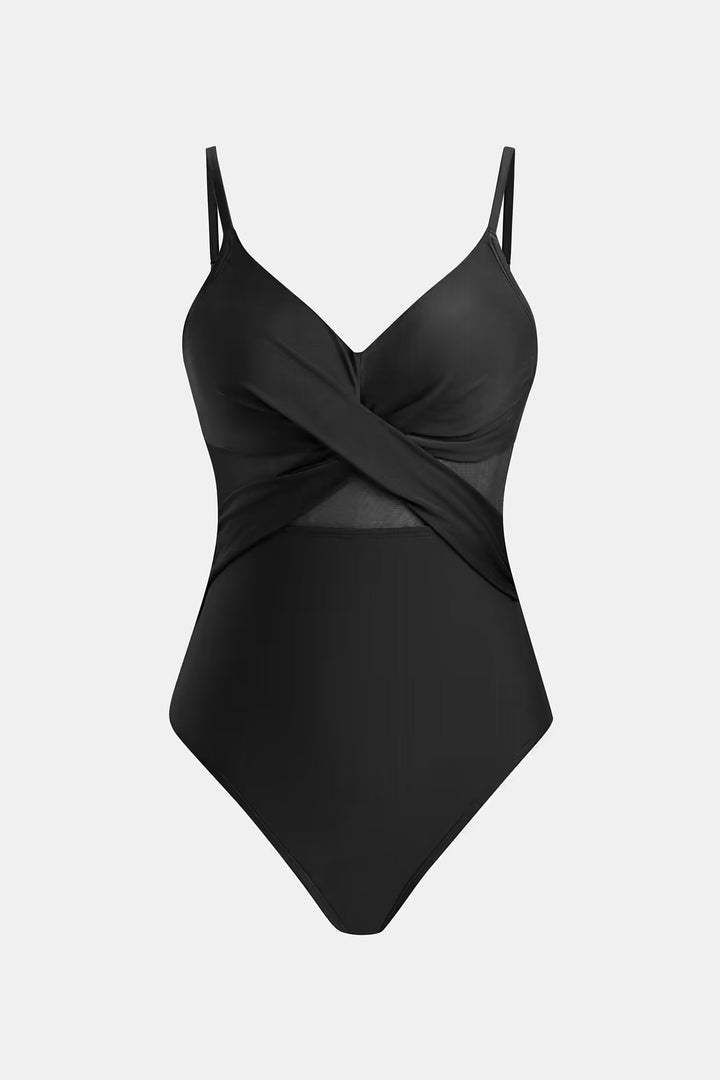 Flat lay of the black one piece swimsuit showing the V-neck and mesh details