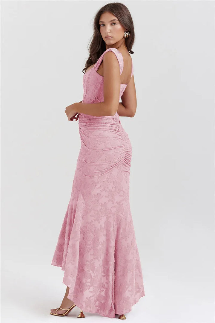 Women pink floral square neck maxi dress, side angle showing the asymmetrical hemline and fitted back.