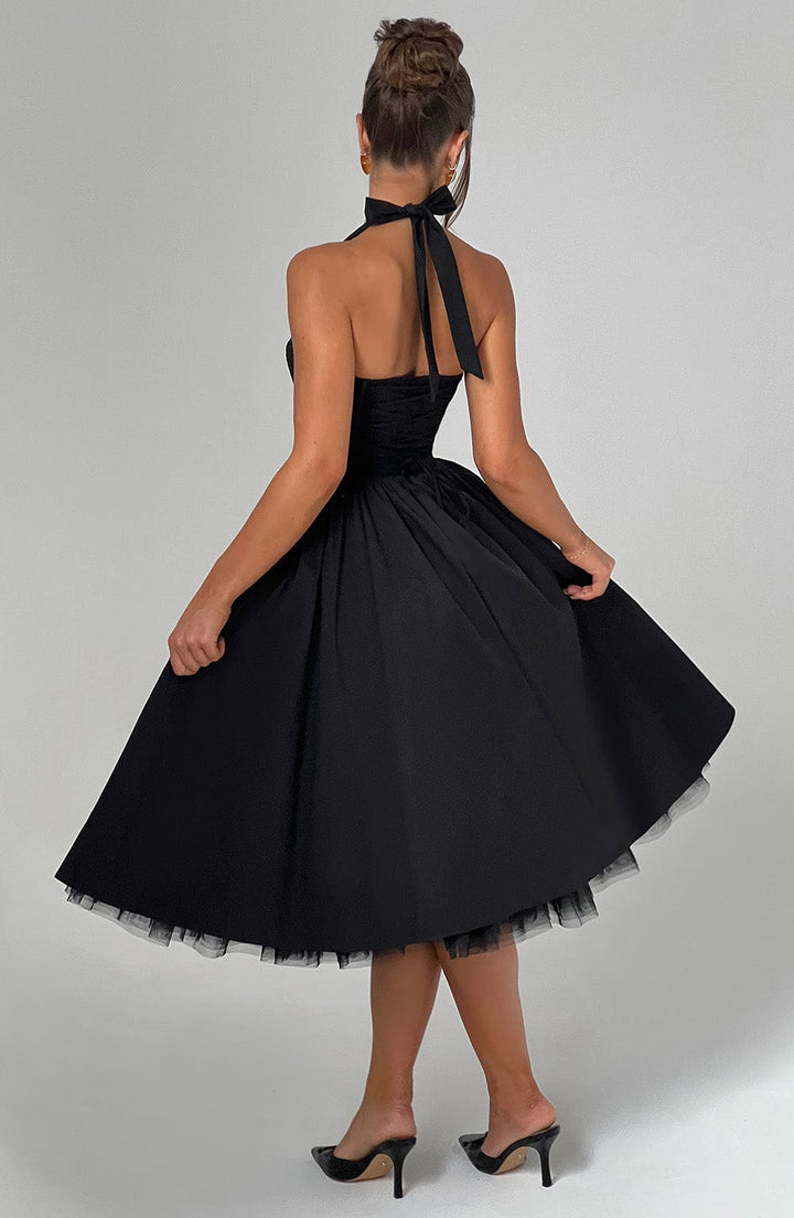 Women black halter neck midi dress with tie neck and full skirt, back view
