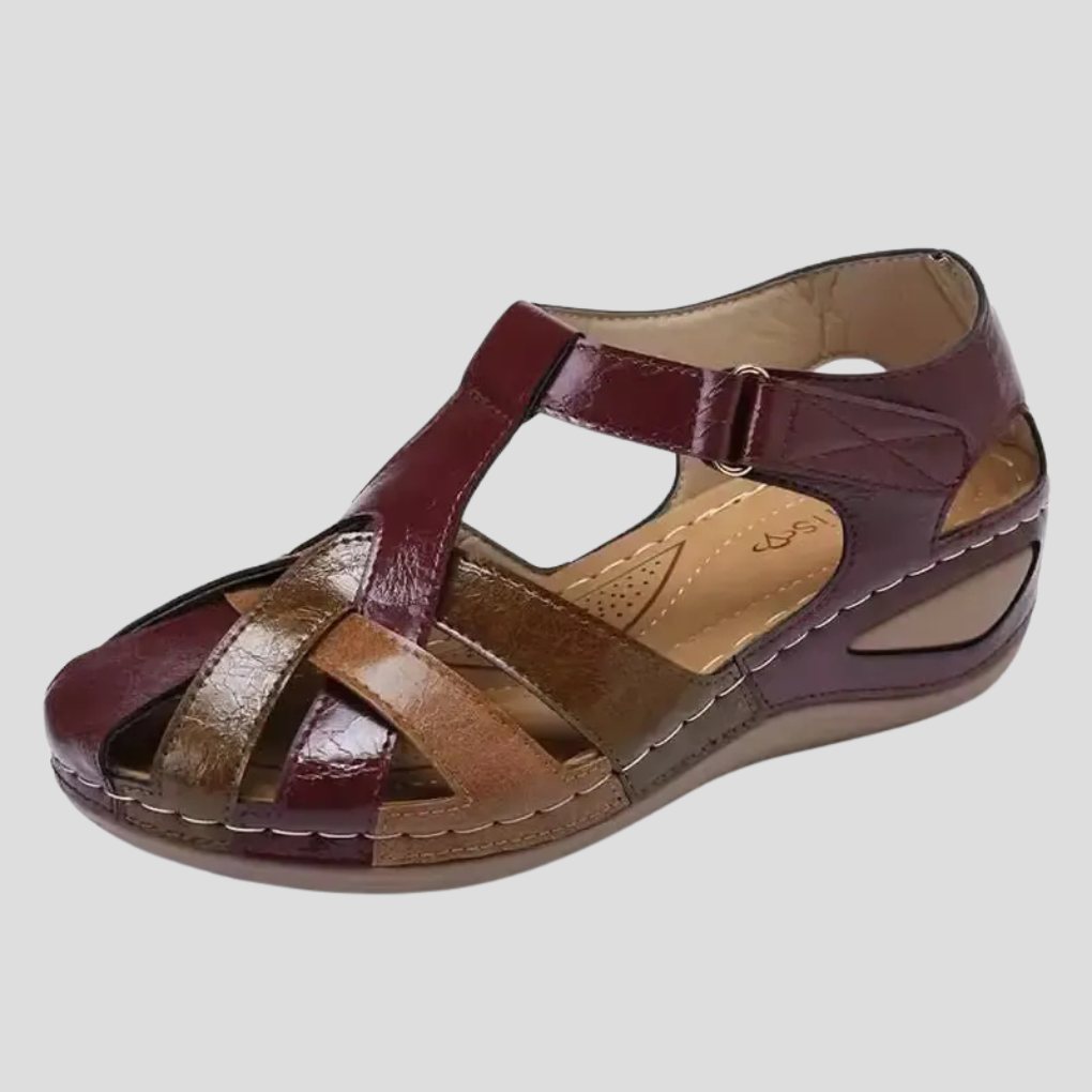 Women's burgundy multi-strap wedge sandals with gold and brown accents, front view