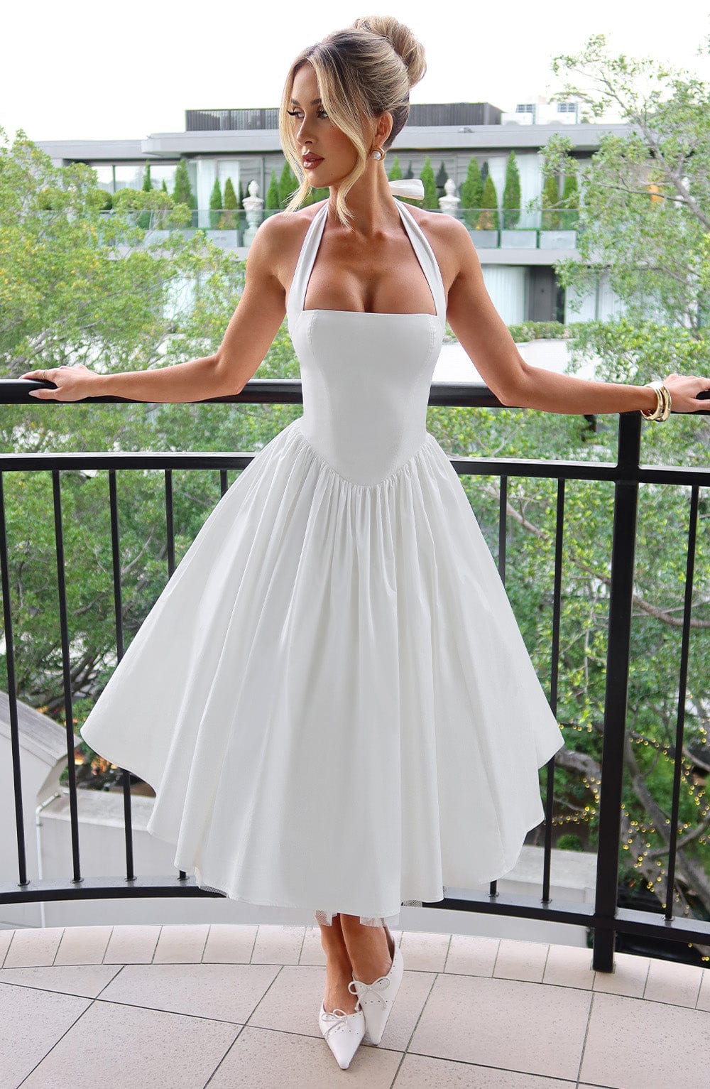 Women white halter neck midi dress with square neckline and full skirt, front view