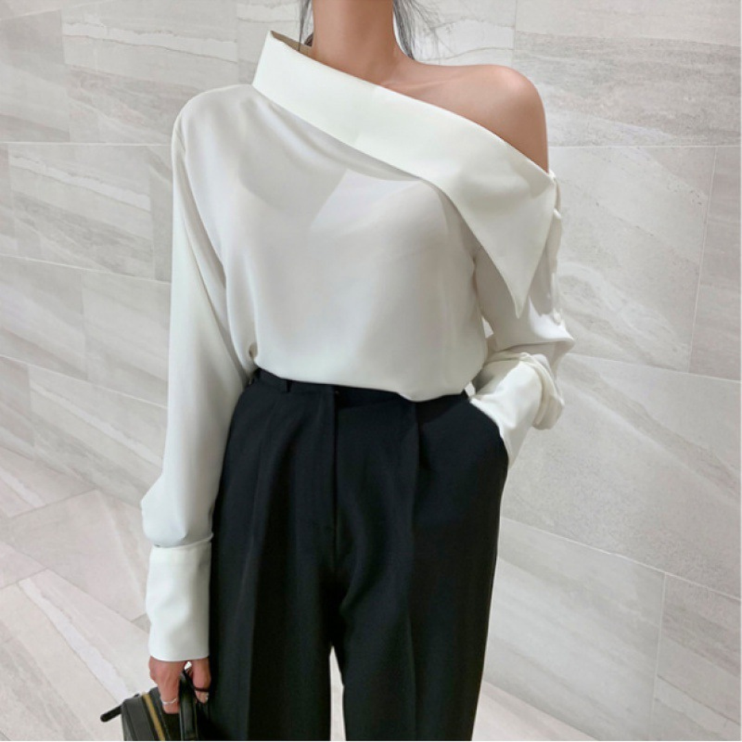 Women white off-shoulder blouse with asymmetrical folded neckline and long structured sleeves