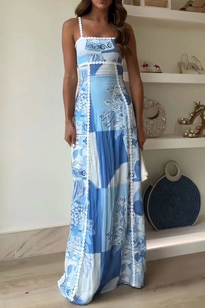Women blue and white printed maxi dress with square neckline and thick straps, front view.