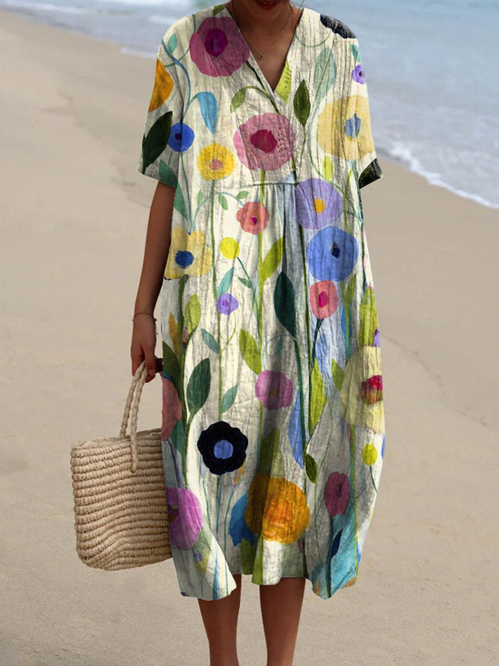 Women bright floral printed midi dress with V-neck and short sleeves, front