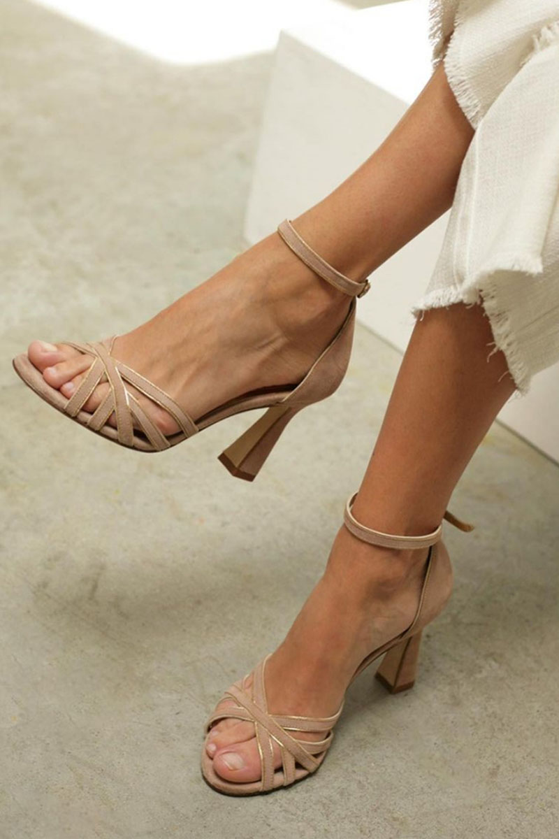 Women nude peep toe heels with crisscross straps and an ankle strap in a side view