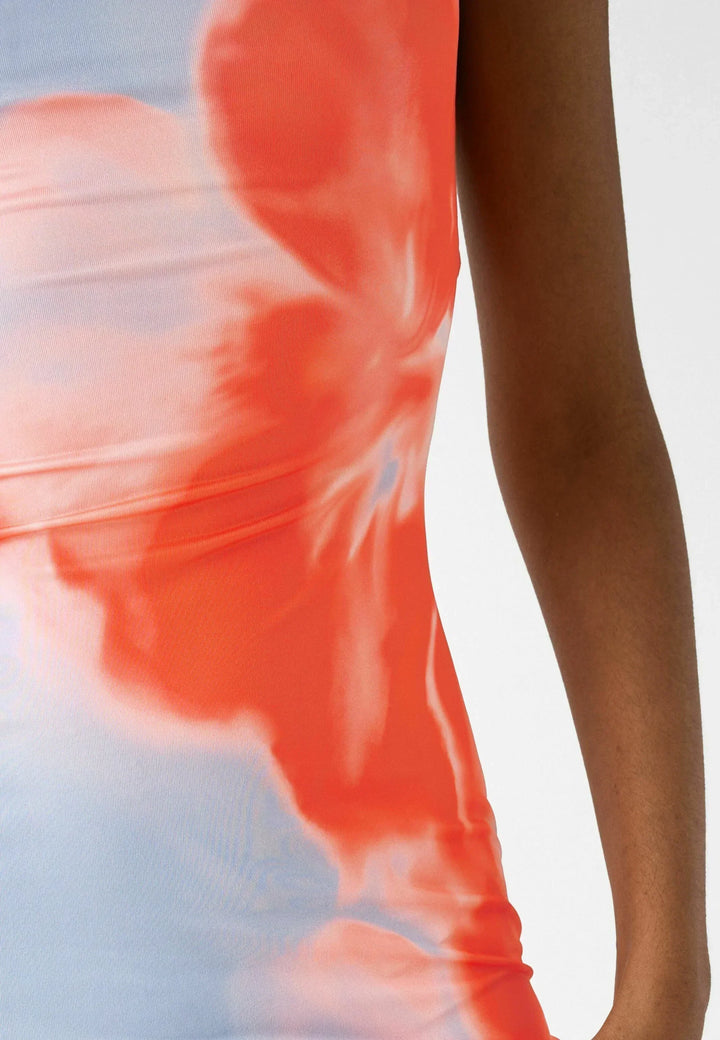 Close up view of the blue and red floral fabric pattern and side of the maxi dress