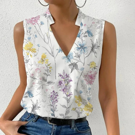 Women white floral V-neck sleeveless blouse with yellow and blue flowers, front view