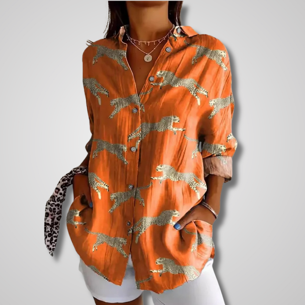 Women's orange leopard print button-down long sleeve shirt, front view with rolled sleeves