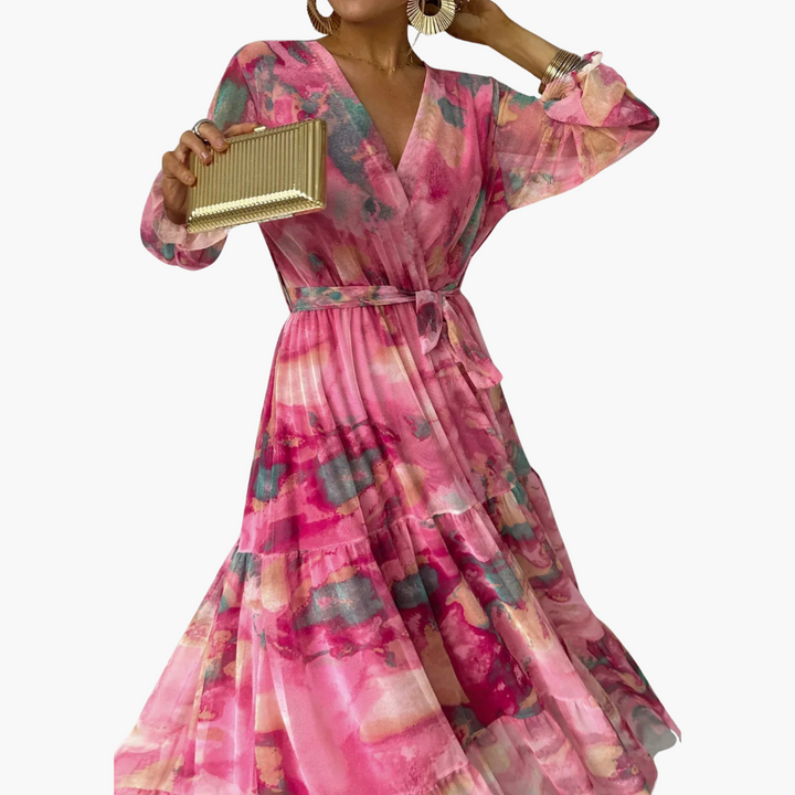 Women's pink floral print maxi dress with V-neckline and tie waist detail, close up