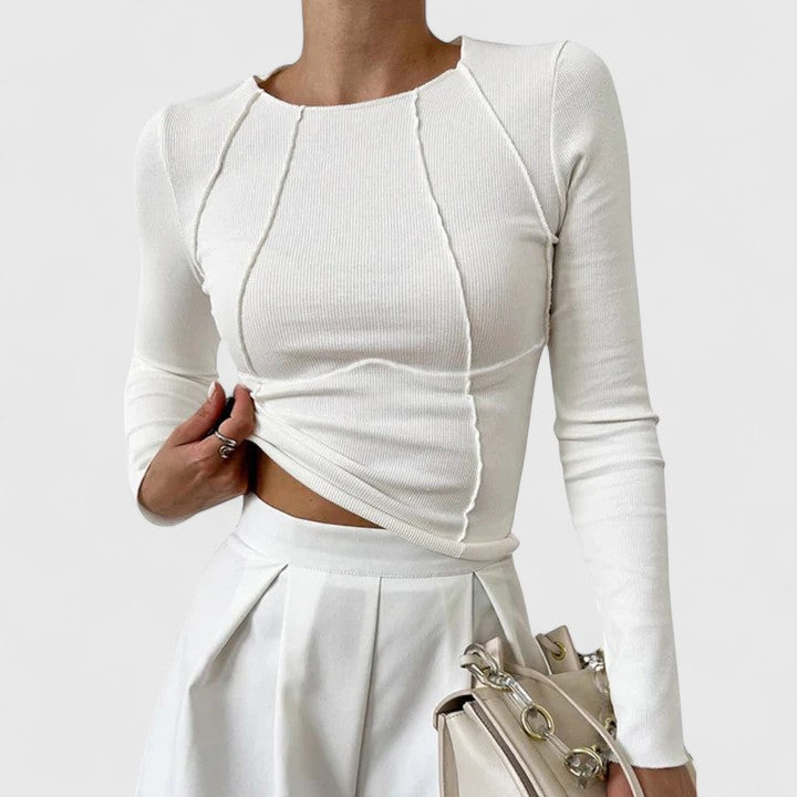 Women white ribbed knit long sleeve top with exposed seam detailing, front view