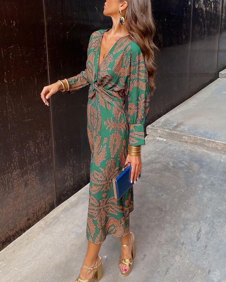 Women green printed maxi dress with V-neckline, long sleeves, and waist knot detail