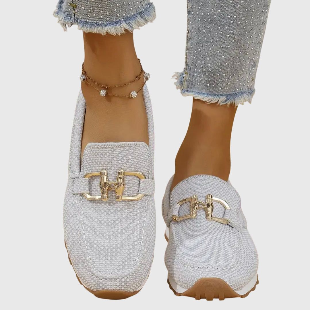 Women light grey slip on buckle loafers with gold-toned buckle detail, close up front