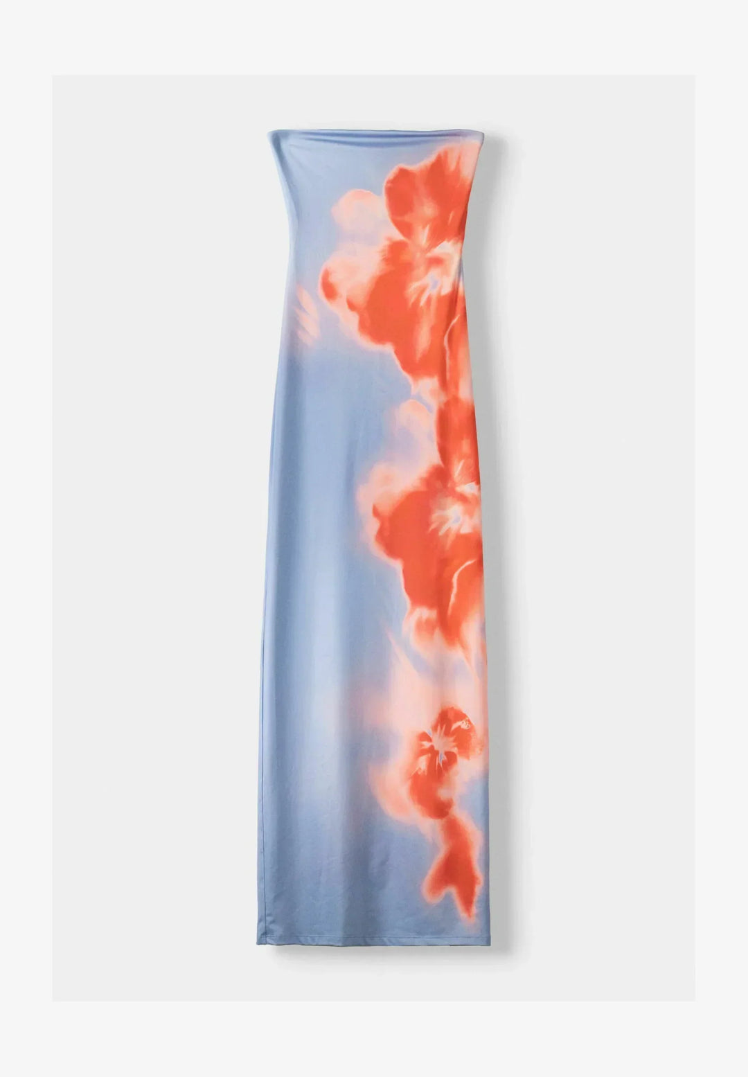 Flat lay of a strapless light blue and orange floral maxi dress with pattern