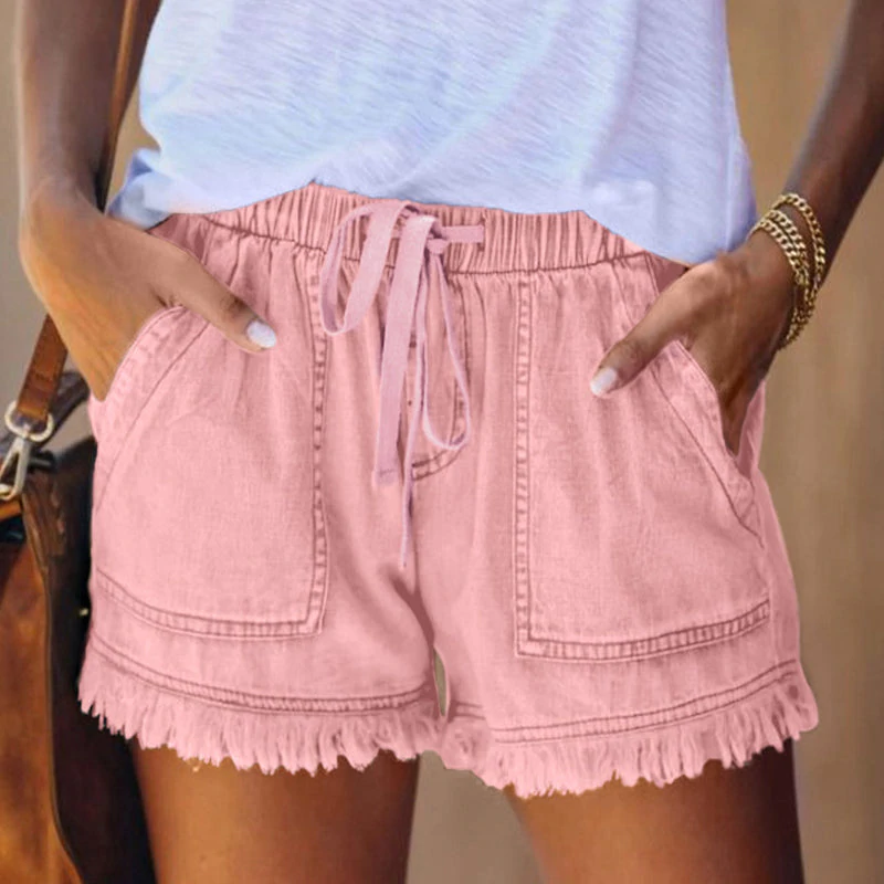 Women pink casual shorts featuring an elastic drawstring waistband and front patch pockets.