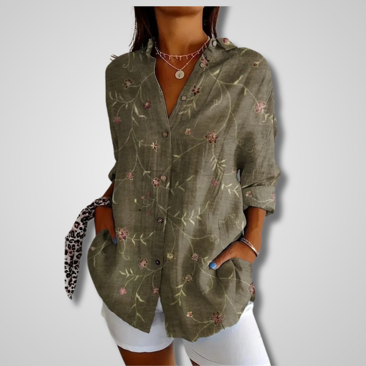 Women's green embroidered floral print button-down long sleeve shirt, front view on model