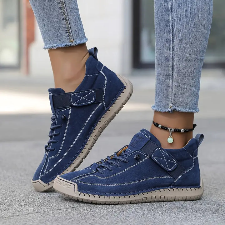 Women blue suede lace-up low-profile walking sneakers with white stitching and light sole