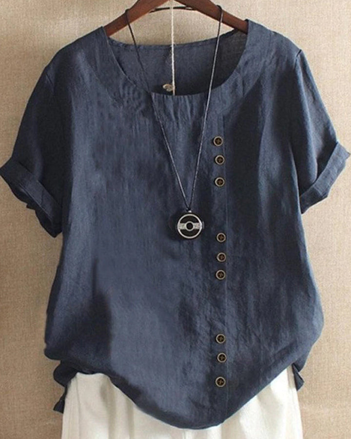 Women blue short sleeve blouse with round neck, side button closure, and cuffed sleeves