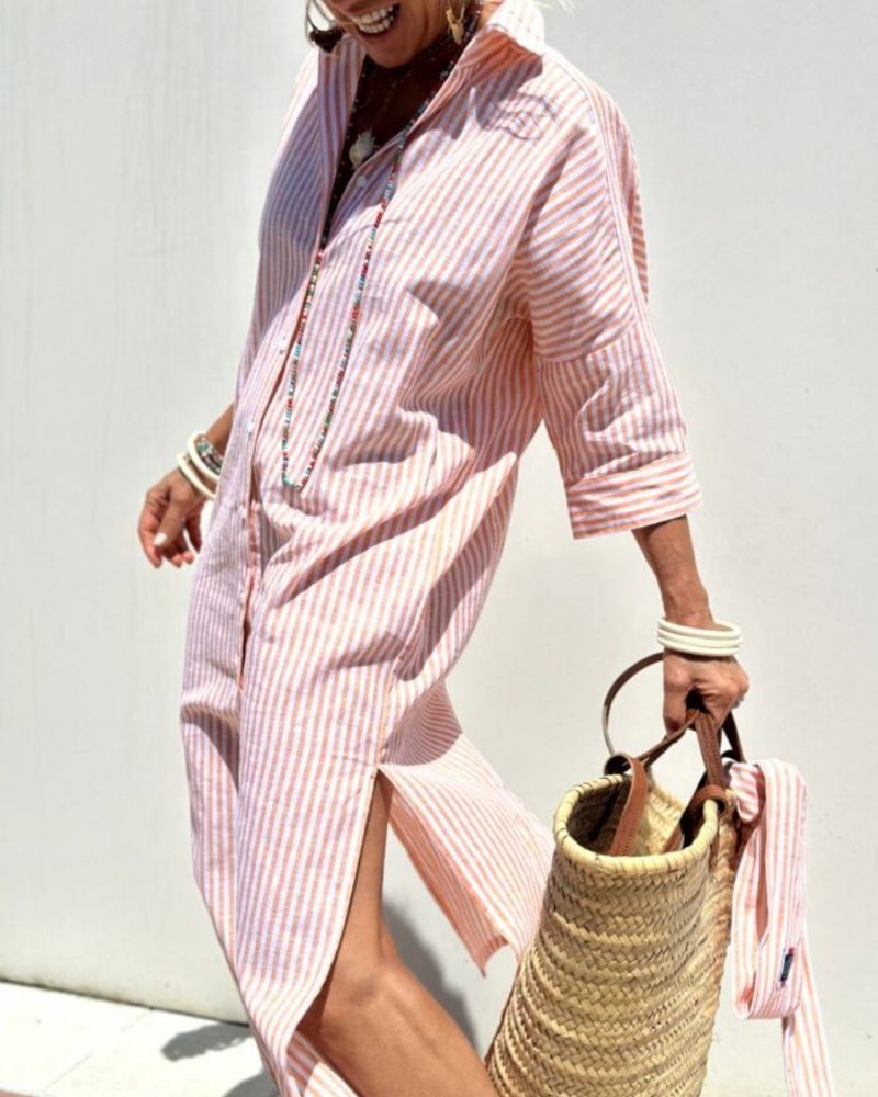Women striped pink and white maxi shirt dress with button-down front, moving side view.