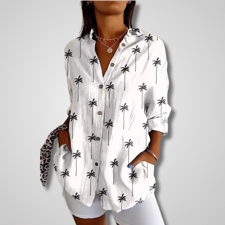 Women's white palm tree print button-down long sleeve shirt, front view with visible buttons