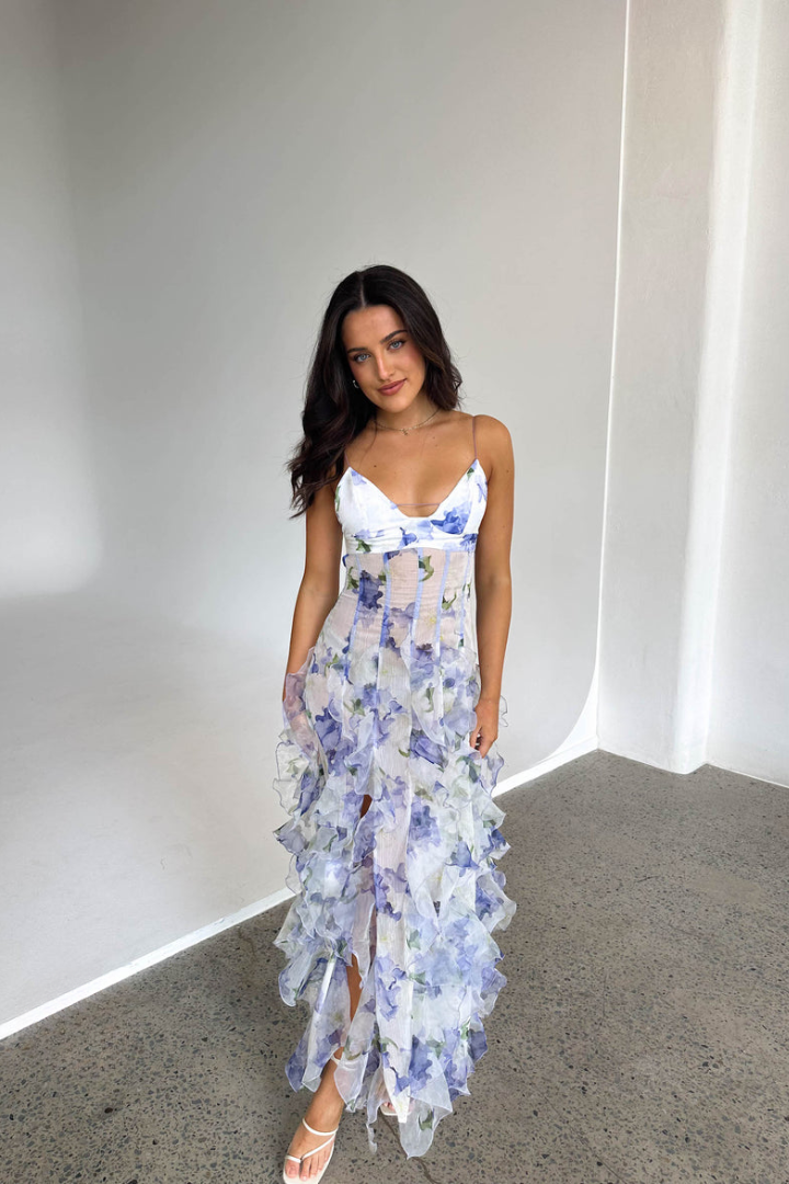 Women white and blue floral maxi dress with V-neckline and spaghetti straps, full length