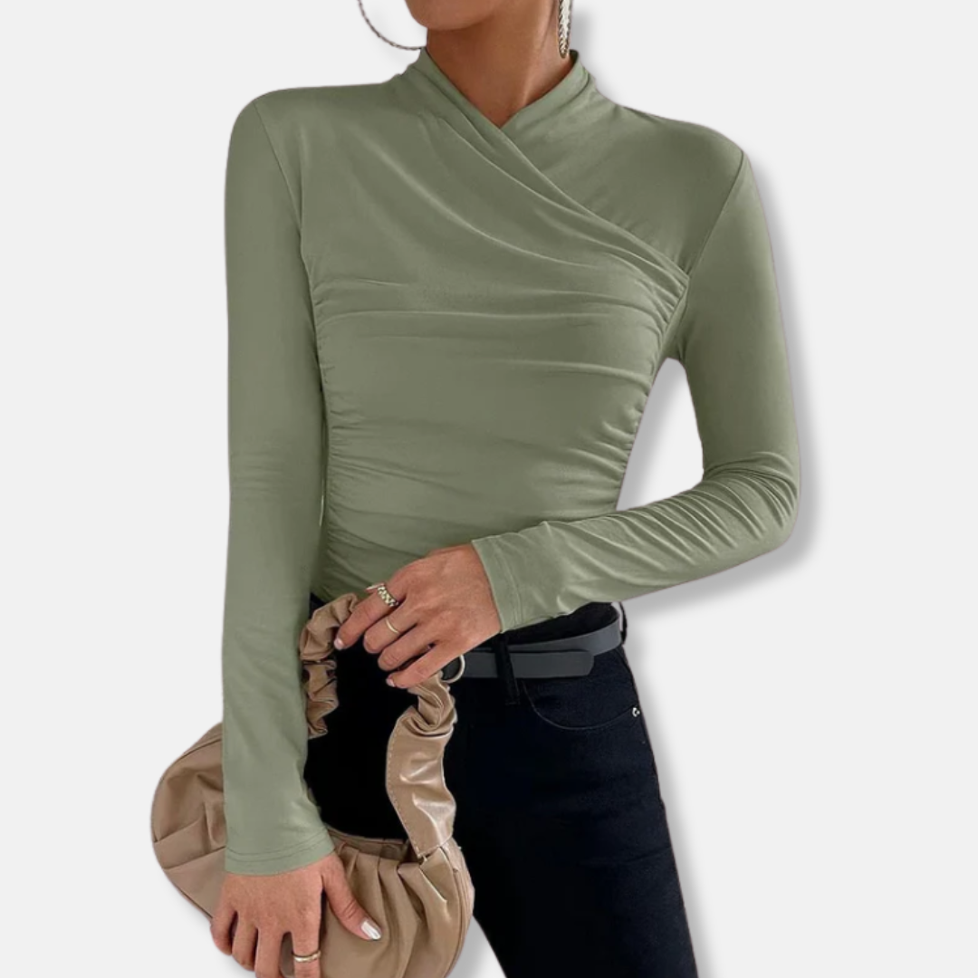 Women sage green long sleeve ruched cross neck top with handbag and metal earrings