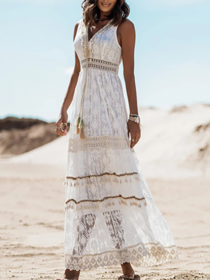 Women white sleeveless V neck lace maxi dress, straight full-body view showcasing tiered skirt and tassel detail.