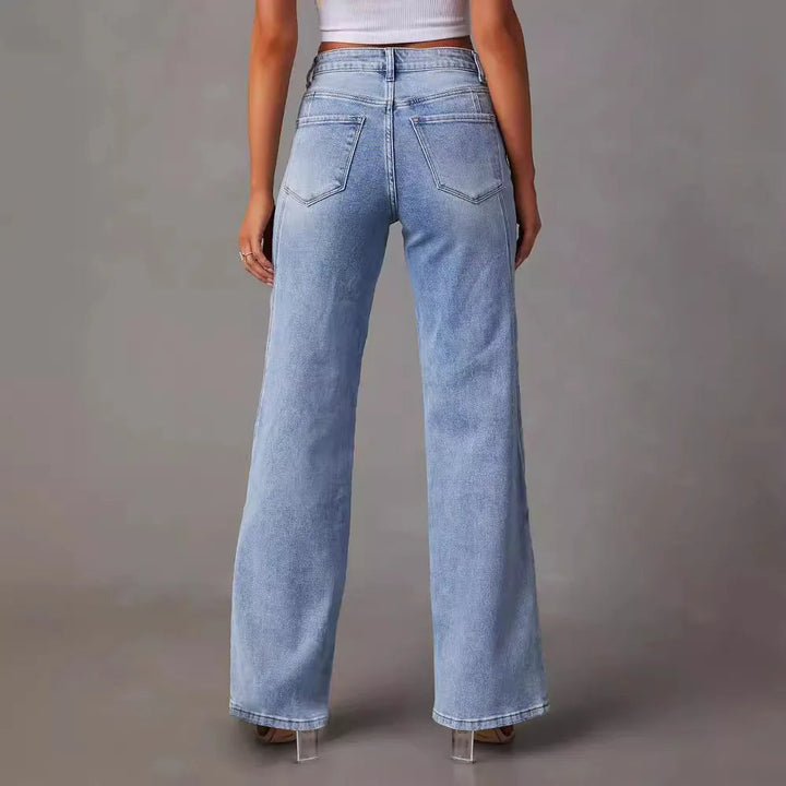 Women light blue high waisted wide leg jeans with front seams, back view