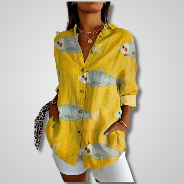 Women's yellow fish print button-down long sleeve shirt, front view with collared neckline