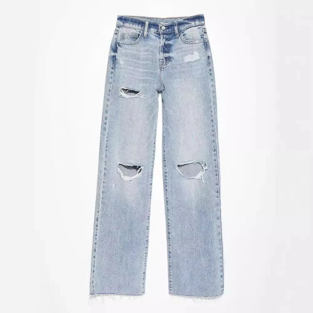 Light blue ripped straight leg jeans laid flat highlighting knee rips and frayed hem