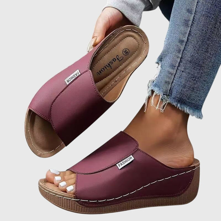 Women maroon open toe wedge sandals, displaying the wide strap and overall design.