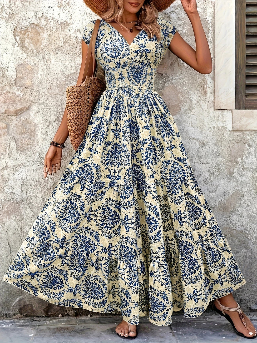 Women blue paisley print maxi dress with V-neck, short sleeves, shirred bodice, and ruffle hem
