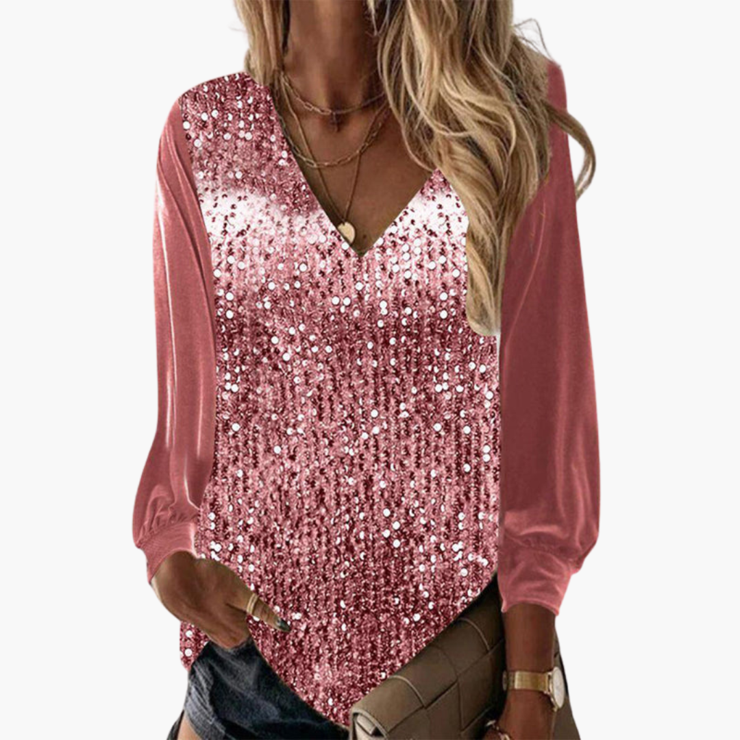 Women pink sequin V-neck long sleeve top with solid sleeves, front view on model