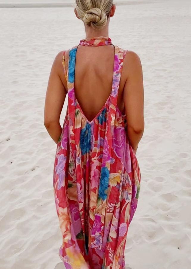 Women's back view of red floral print maxi sundress featuring deep V-back and shoulder straps.