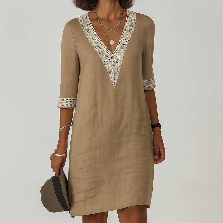 Women tan mini dress with V-neckline and crocheted sleeve cuffs, front view