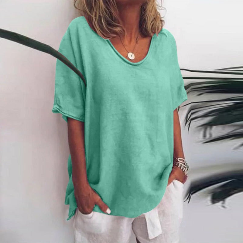 Women mint green loose fit V neck t-shirt with visible fabric texture, front view.