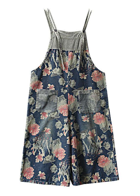 Women's floral printed midi denim romper, flat lay view showing strap and pocket details.