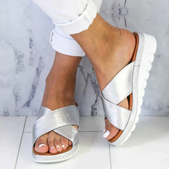 Women's silver casual platform sandals with crossed straps and white ridged sole