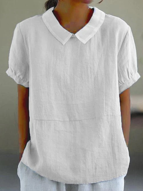 Women white short sleeve rounded collar blouse with relaxed fit and subtle fabric texture