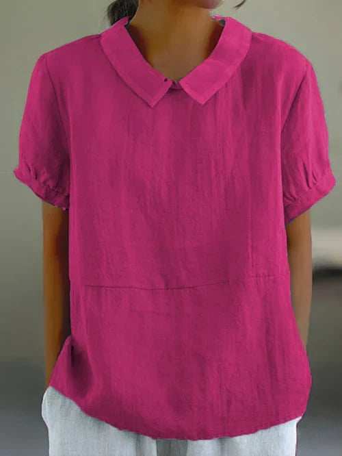 Women fuchsia short sleeve blouse with Peter Pan collar and gathered cuffs, worn by model