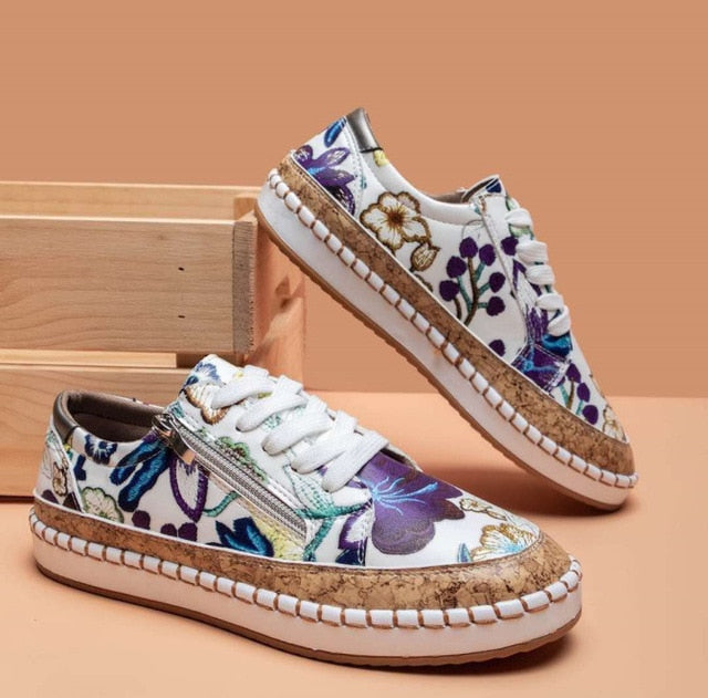 Women white floral print sneakers with purple and green flowers, white laces and side zipper