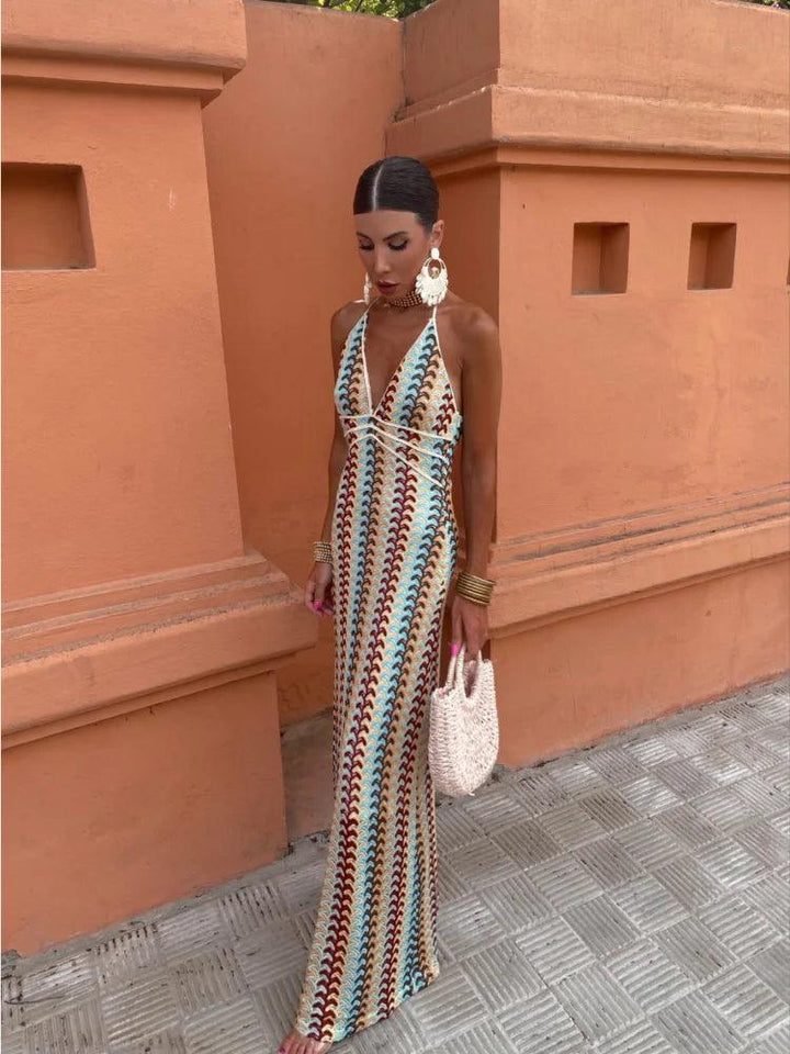 Women patterned halter V neck maxi dress full body front view standing outdoors