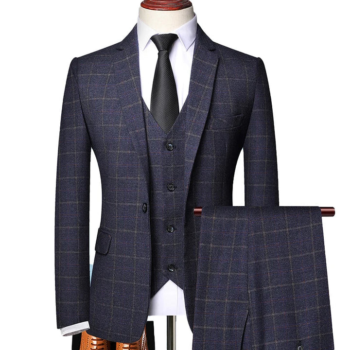 Men's dark blue windowpane plaid three-piece suit set featuring a structured blazer and vest