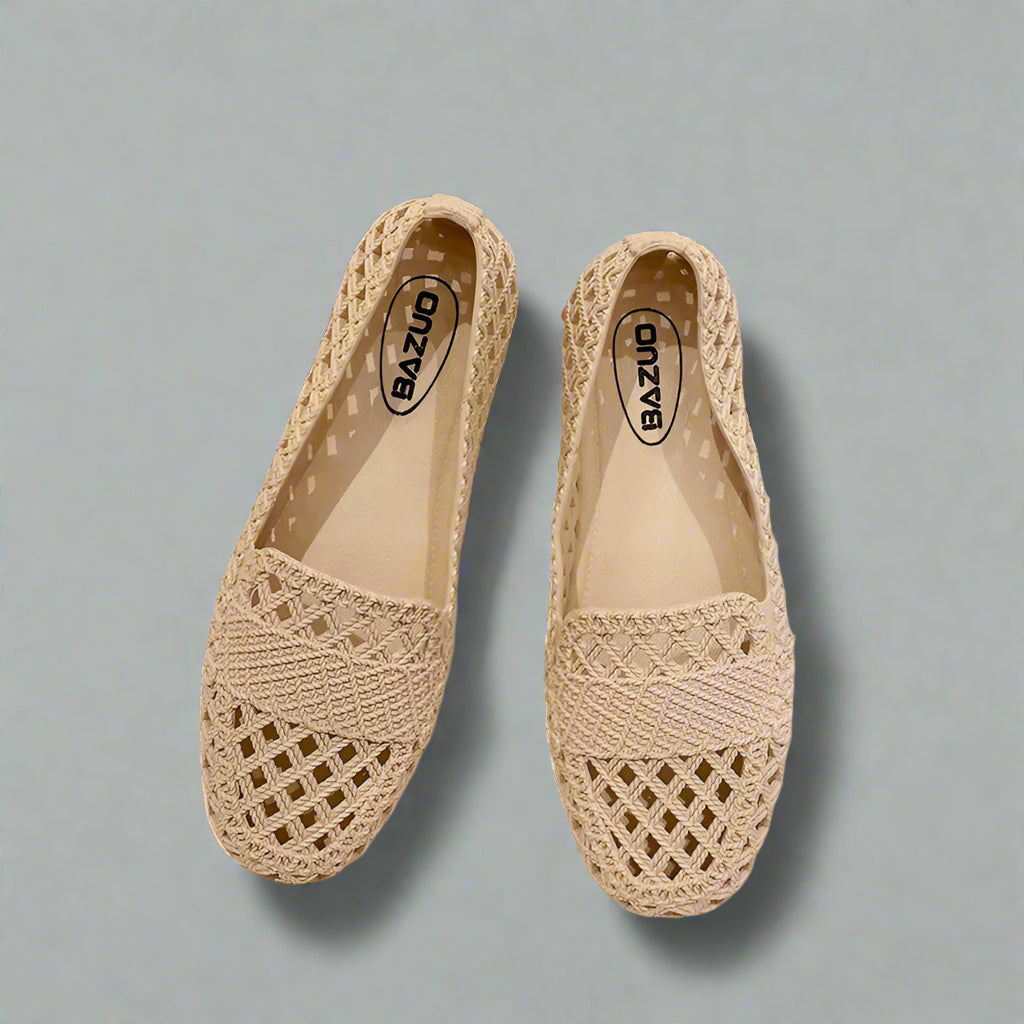 Women beige woven knit slip-on flats with pointed toe design on a light gray background.