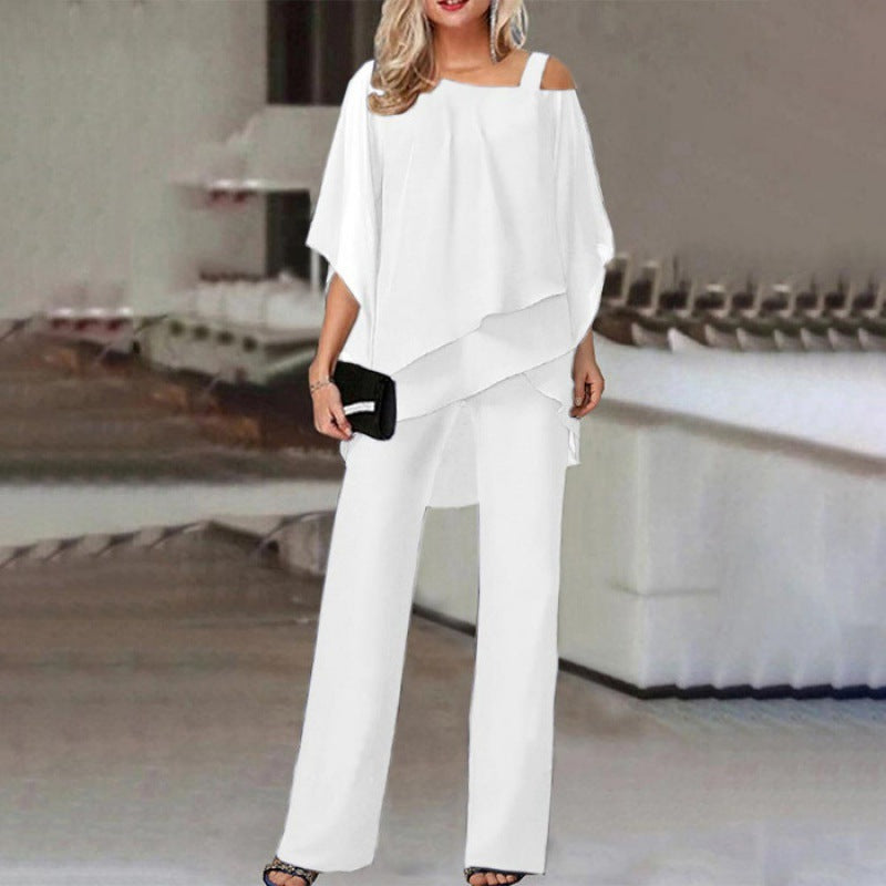 Women white sleeveless off shoulder layered pant set, front view of model