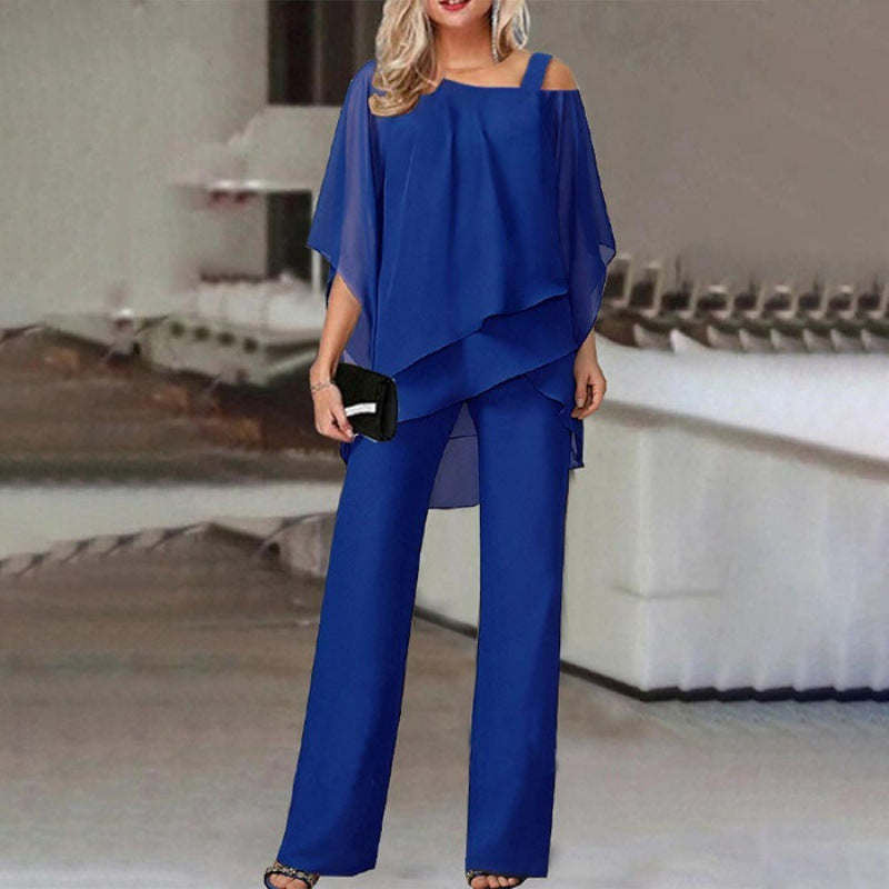 Women vivid blue sleeveless off shoulder layered pant set, model posing