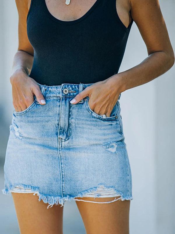Women light blue distressed denim mini skirt with high waist and frayed hem, front view