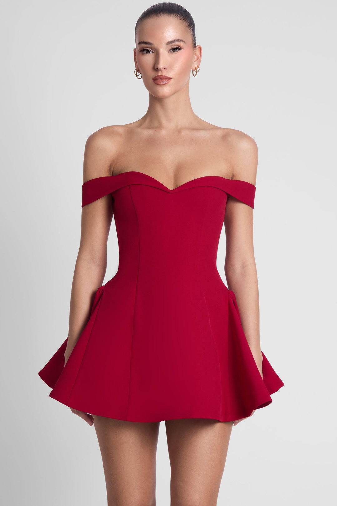 Women red off-shoulder babydoll mini dress with structured skirt, front view