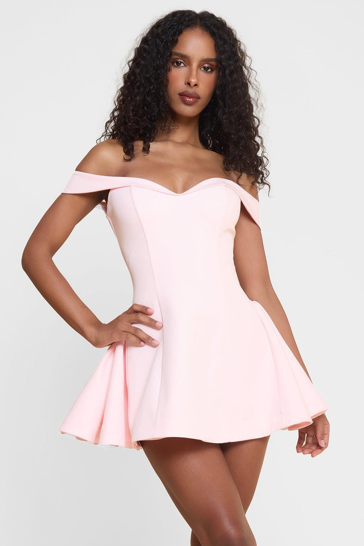 Women light pink off-shoulder babydoll mini dress, side pose